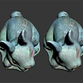 Two Turquoise Decorative Sitting Rabbit Statues on Dark Reflective Surface