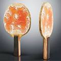 Two Table Tennis Paddles With Orange White Marbled Surface And Dark Handles As Sport Equipment