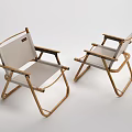 Two Folding Lounge Chairs With Wooden Frame And Light Fabric Seat In Minimalist Design