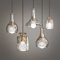 Set of Glass Chandeliers with Decorative Patterns and Brass Accents for Modern Interior Lighting