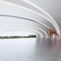 Spacious Exhibition Hall With Large Orange Sculpture Curved White Walls And Floor To Ceiling Windows