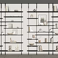 Sleek Black Bookcase With Multiple Shelves Featuring Books Decorative Items And Picture Frame