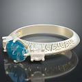 Elegant Gold Ring With Blue Topaz Stone And Intricate Engraved Patterns 3d model
