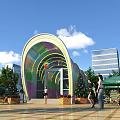 Building Facade with Arched Colorful Glass Design Surrounded by Pedestrians Green Plants and Street Lamps