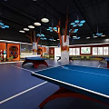 Indoor Sports Fitness Center with Ping Pong Tables Modern Lighting and Training Area