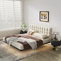 Modern Beige Double Bed with Tufted Headboard Blankets Pillows Nightstands Vase Flowers and Table Lamp