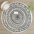 Round Black and White Mandala Geometric Pattern Rug with Open Book in Living Space