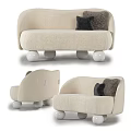 Modern Beige Fluffy Irregular Shaped Sofa With Spherical Legs And Black Cushions