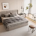 Modern Double Bed with Grey Headboard Striped Comforter Pillows and Nightstands in Bright Bedroom