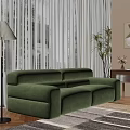 Elegant Green Velvet Sectional Sofa In Living Room With Sheer Curtains And Floor Plants