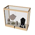 Glass Display Cabinet With Gold Frame Showcasing Jewelry On Display Stands And Mannequins