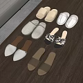 Comfortable Neutral Toned Slippers with Various Fabric and Leather Styles on Wooden Floor