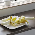 Peeled Bananas on White Plate with Wooden Countertop and Window Background