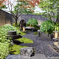 Serene Garden Landscape With Various Plants Stone Pathway And Wooden Deck
