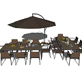 Outdoor Table And Chair Combination With Brown Umbrella Fruits And Tableware