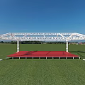 Outdoor Event Stage Featuring White Metal Frame Red Floor Green Grass And Blue Sky