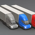 Three Different Colored Commercial Trucks With Long Trailers in Gray Blue and Red