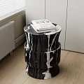 Black And White Marble Side Table With Cylindrical Design And Books On Wooden Floor