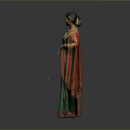 Woman In Green Saree With Red Borders Standing Against Dark Background