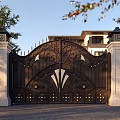 Ornate Iron Gate With Intricate Carvings Stone Pillars And Lamp Posts Front Residential House Trees