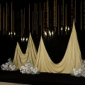 Elegant Golden Drapery Setup With Candelabras White Flowers And Black Backdrop