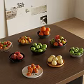 Various Fresh Fruits Arranged In Bowls And Plates On Wooden Table