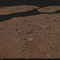 Damaged Ground Surface With Scattered Stones On Yellowish Brown Soil And Gray Background