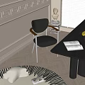 Modern Black Leather Dining Chair With Wooden Armrests And Metal Legs In Bright Dining Area