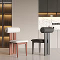 Modern Dining Chairs In Open Kitchen With White Upholstered Seats Black Frames And Marble Countertop