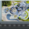 Colorful Children's Play Area With Curved Slides Circular Tracks And Green Lawns