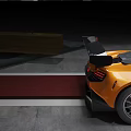 Orange Sports Car With Rear Wing And Aerodynamic Front Design On Track Surface