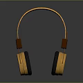 Gold and Black Over Ear Computer Headphones with Orange Headband and Reflection on Gray Background