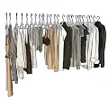 Assorted Clothes Hanging On Hangers With Various Styles And Colors Neatly Arranged