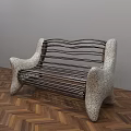 Unique Public Bench With Curved Speckled Arms And Metal Slats On Herringbone Wooden Floor