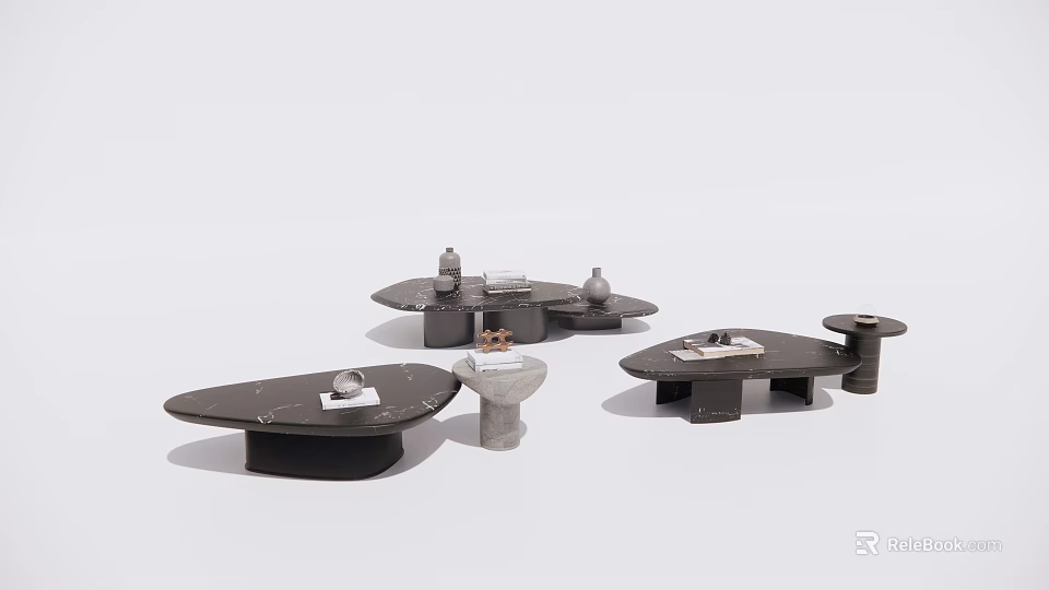 Modern Coffee Tables With Unique Shapes And Dark Surfaces Featuring Decorative Items 3d model