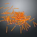 Bunch of Orange Pencils with Red Tips Scattered on Gray Background