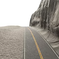 Winding Road Along Massive Rocky Cliff Featuring Double Yellow Lines And Gravel Ground