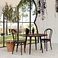 Elegant Dining Table Set With Wooden Chairs Large Window And Olive Tree Decor