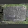 Red Brick Building Model With Arched Windows And Gray Roof On Grass Field And Path