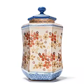 Octagonal Ceramic Jar With Blue Lid And Colorful Floral Patterns On White Base
