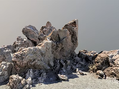 Natural Rock Formation with Various Sizes and Textures on Sandy Ground Under Clear Sky 3d model