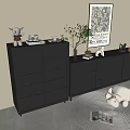 Modern Black Dressers With Potted Plant Decorative Items And Framed Art In Minimalist Interior