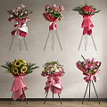 Colorful Flower Bouquets With Pink Wrapping Bowknots Sunflowers Roses And Black Tripods