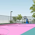 Outdoor Basketball Court with Pink Surface Surrounded by Green Lawn Trees and Spiral Stairs