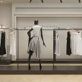 Modern Lady Clothing Store With Mannequin And Hanging White Black Dresses On Racks