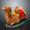 Decorative Camel Figurine With Yellow Red Fabric Saddle And Green Base