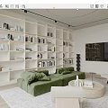 Minimalist Living Room Interior With White Bookshelves Green Sofa TV Wall And Round Coffee Table