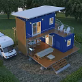 Blue Two Story Container House With Wooden Deck Outdoor Furniture And RV In Green Surroundings