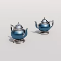 Two Stylish Blue Metallic Teapots With Silver Bases And Elegant Design