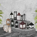 Varied Style Candle Lanterns Decorative Display On Stone Steps With Green Plants
